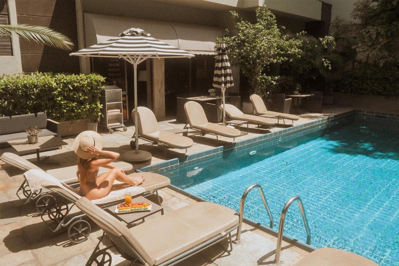 Divani Palace Acropolis Athena Bagian luar foto The pool at the hotel
